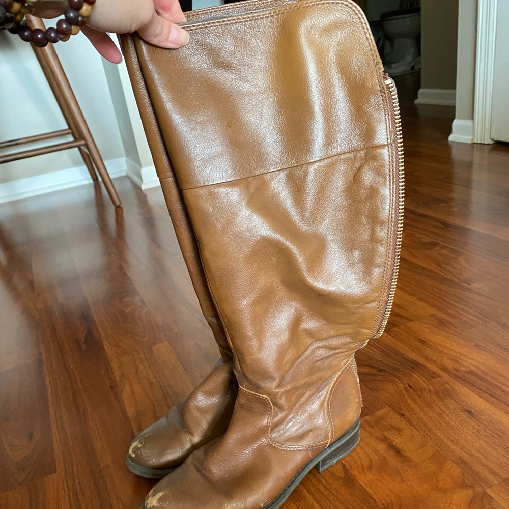Knee high brown leather boots from Aldo.